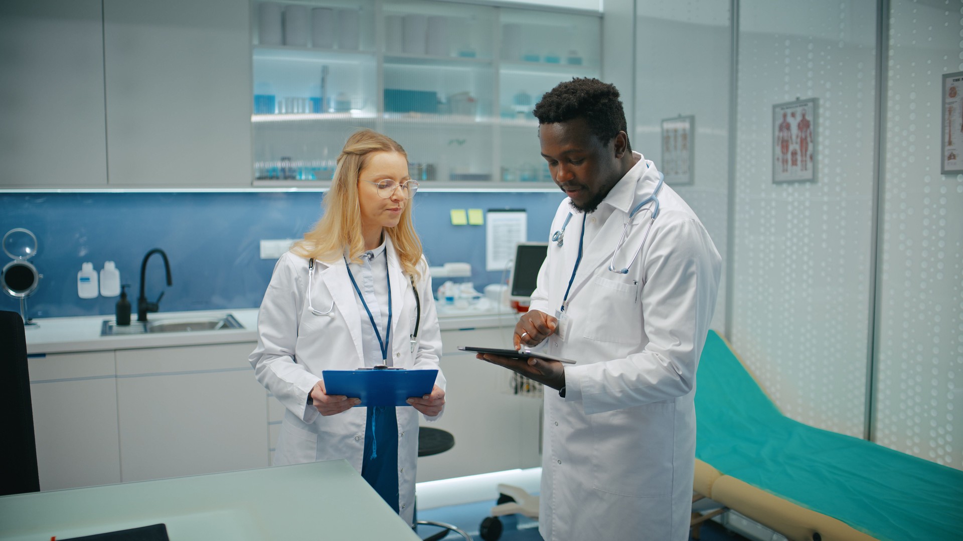 Male and female doctor have medical meeting, consulting and brainstorming patient's documents  and test results to choose the best treatment method